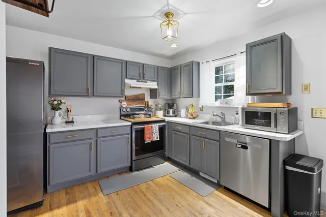 a kitchen with a sink cabinets and window