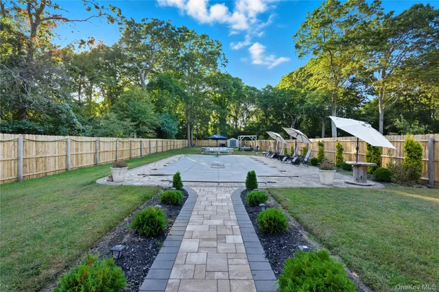 a view of a street with cars parked