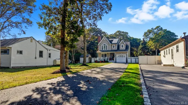 an aerial view of a house with swimming pool a yard and mountain view