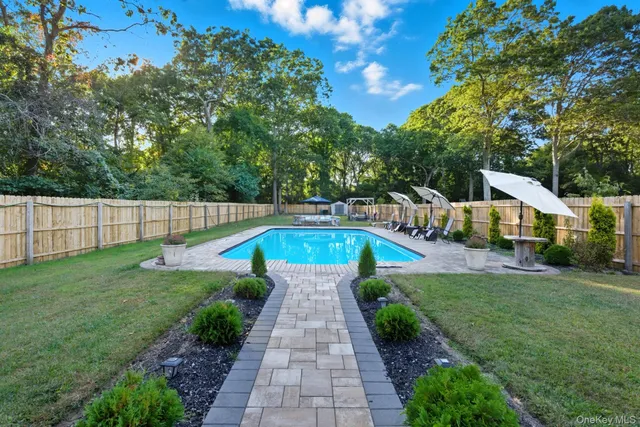 a view of swimming pool with garden