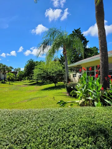 a view of swimming pool with a yard