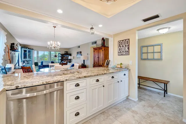 a bathroom with a granite countertop sink a large mirror and a shower