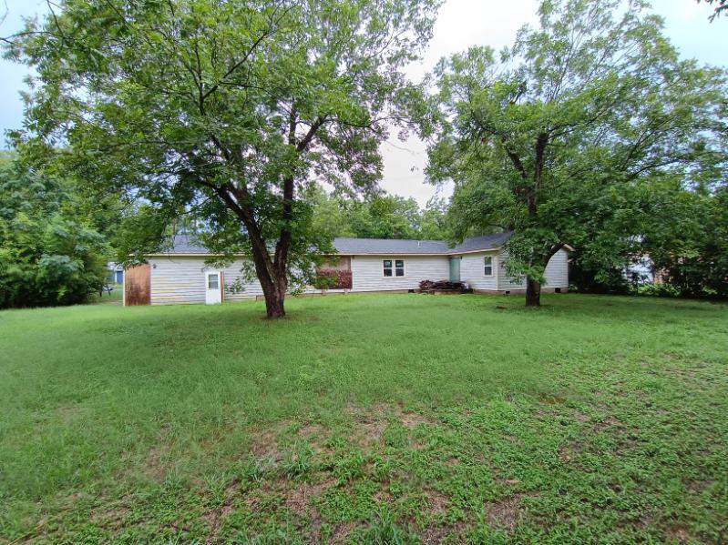 112 Ila Street Elgin, TX 78621 - Photo 3 of 27 a front view of house with yard and trees