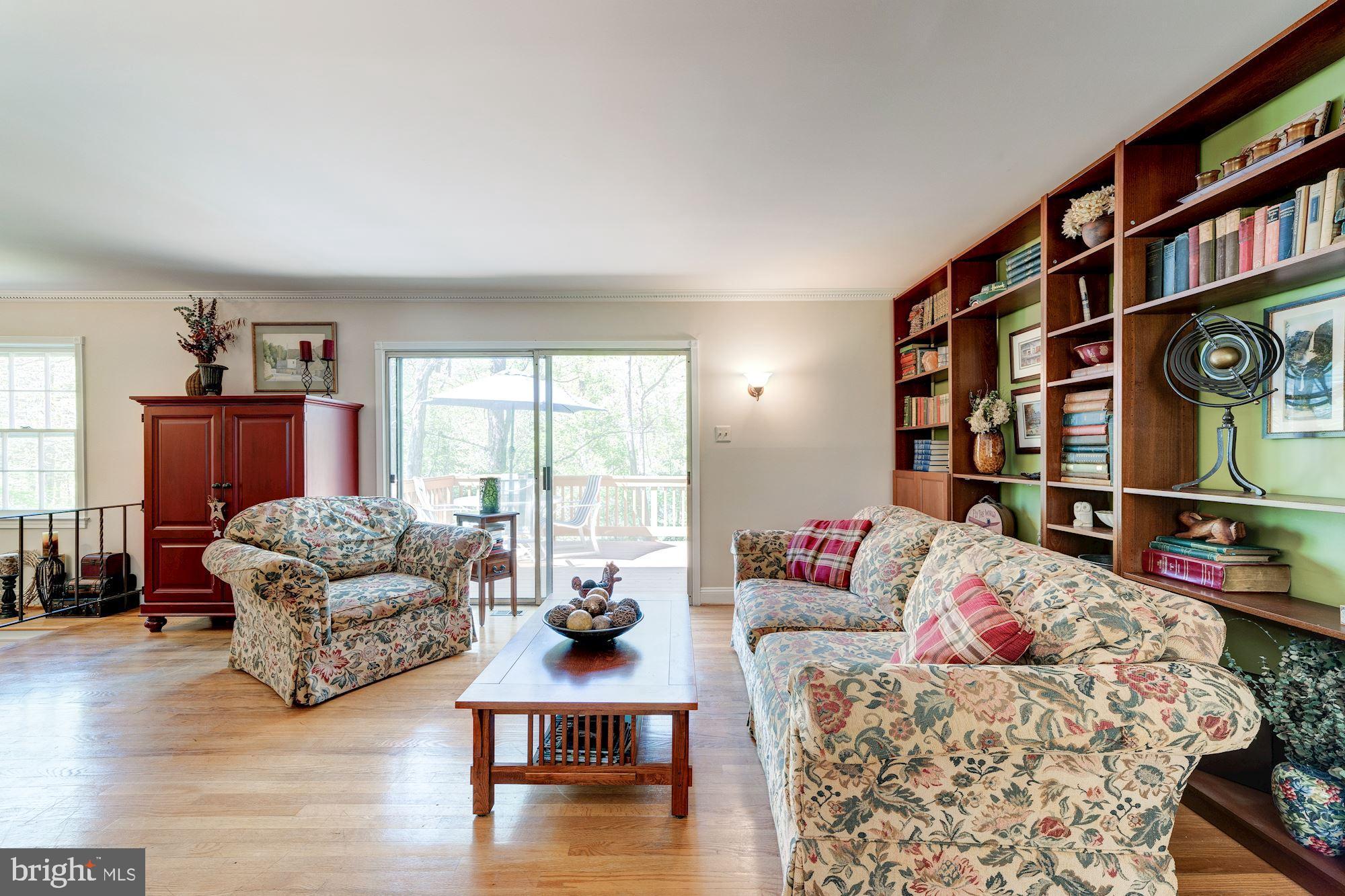 11310 Myrtle Lane Reston, VA 20191 - Photo 17 of 42 a living room with furniture and a book shelf