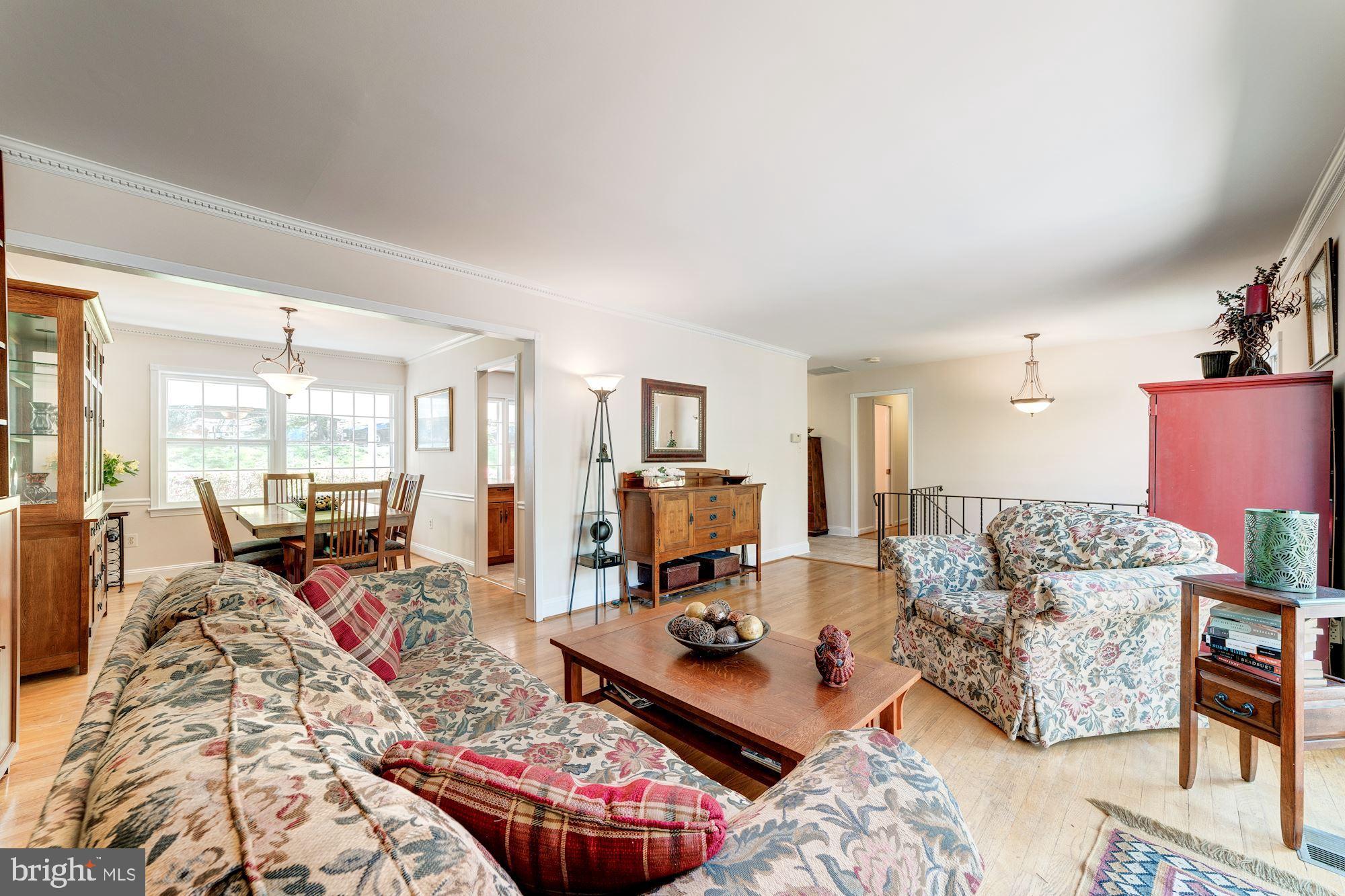 11310 Myrtle Lane Reston, VA 20191 - Photo 18 of 42 a living room with furniture large window and a table