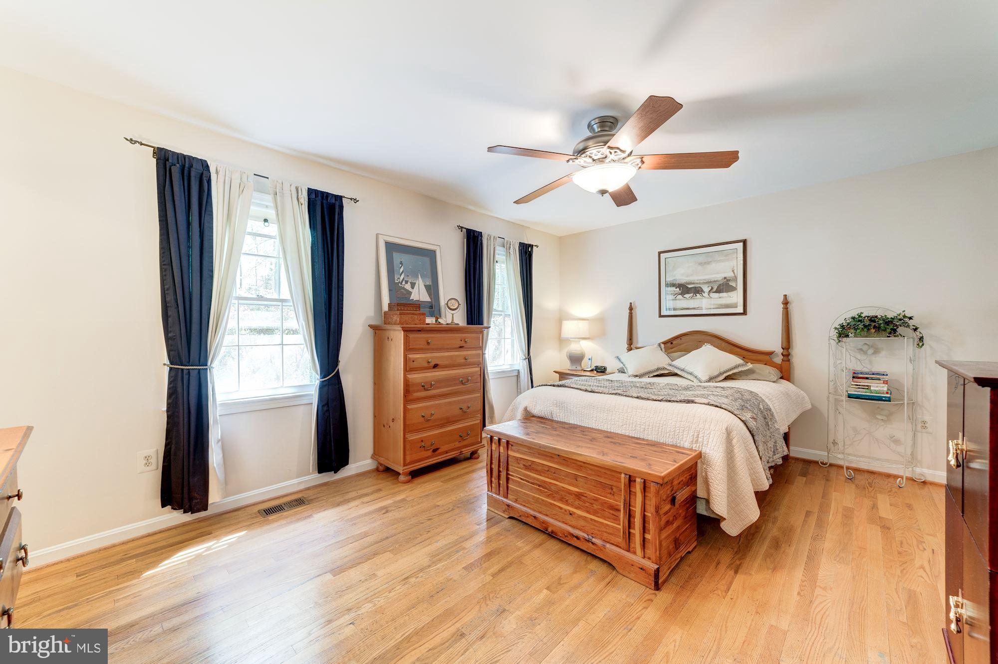 11310 Myrtle Lane Reston, VA 20191 - Photo 19 of 42 a spacious bedroom with a bed and closet
