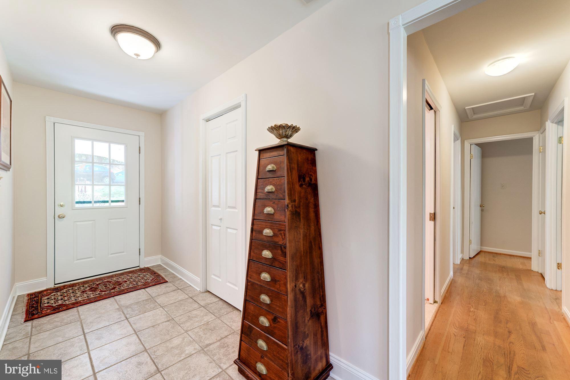 11310 Myrtle Lane Reston, VA 20191 - Photo 3 of 42 a view of a hallway to a bedroom with windows