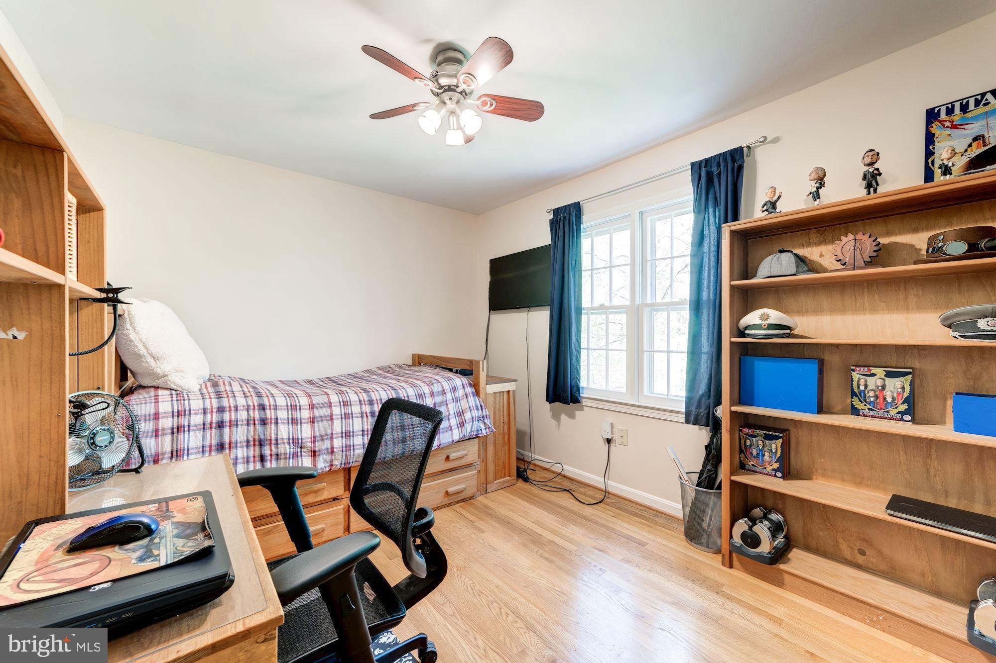 11310 Myrtle Lane Reston, VA 20191 - Photo 22 of 42 a view of a workspace with furniture and a window