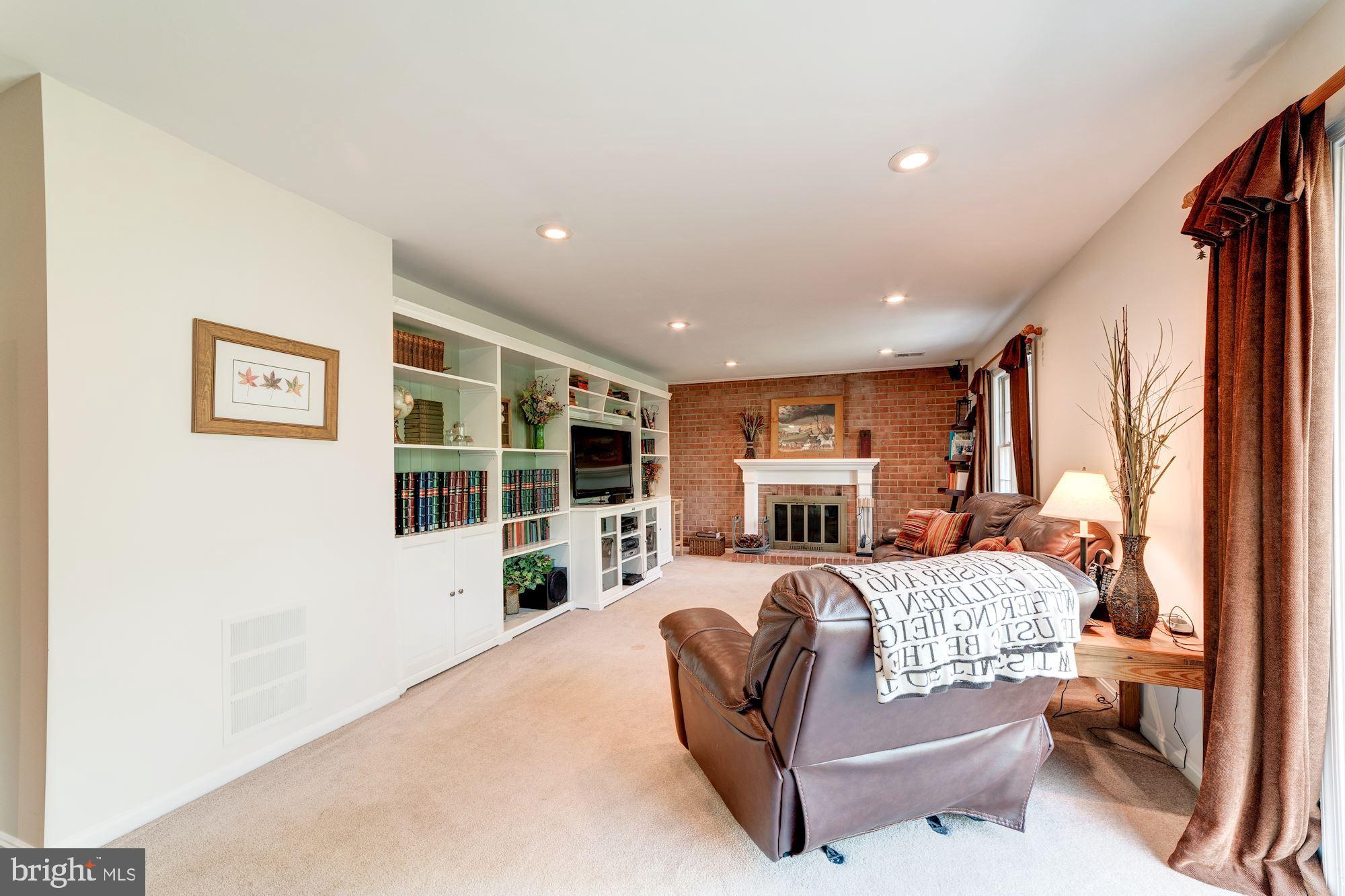11310 Myrtle Lane Reston, VA 20191 - Photo 28 of 42 a living room with furniture a large window and dresser