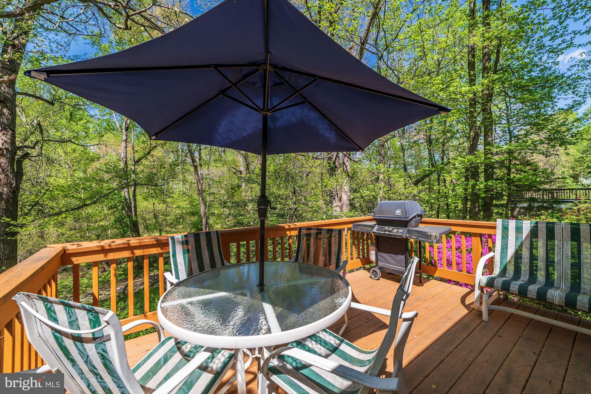 11310 Myrtle Lane Reston, VA 20191 - Photo 36 of 42 an outdoor sitting area with furniture and umbrella