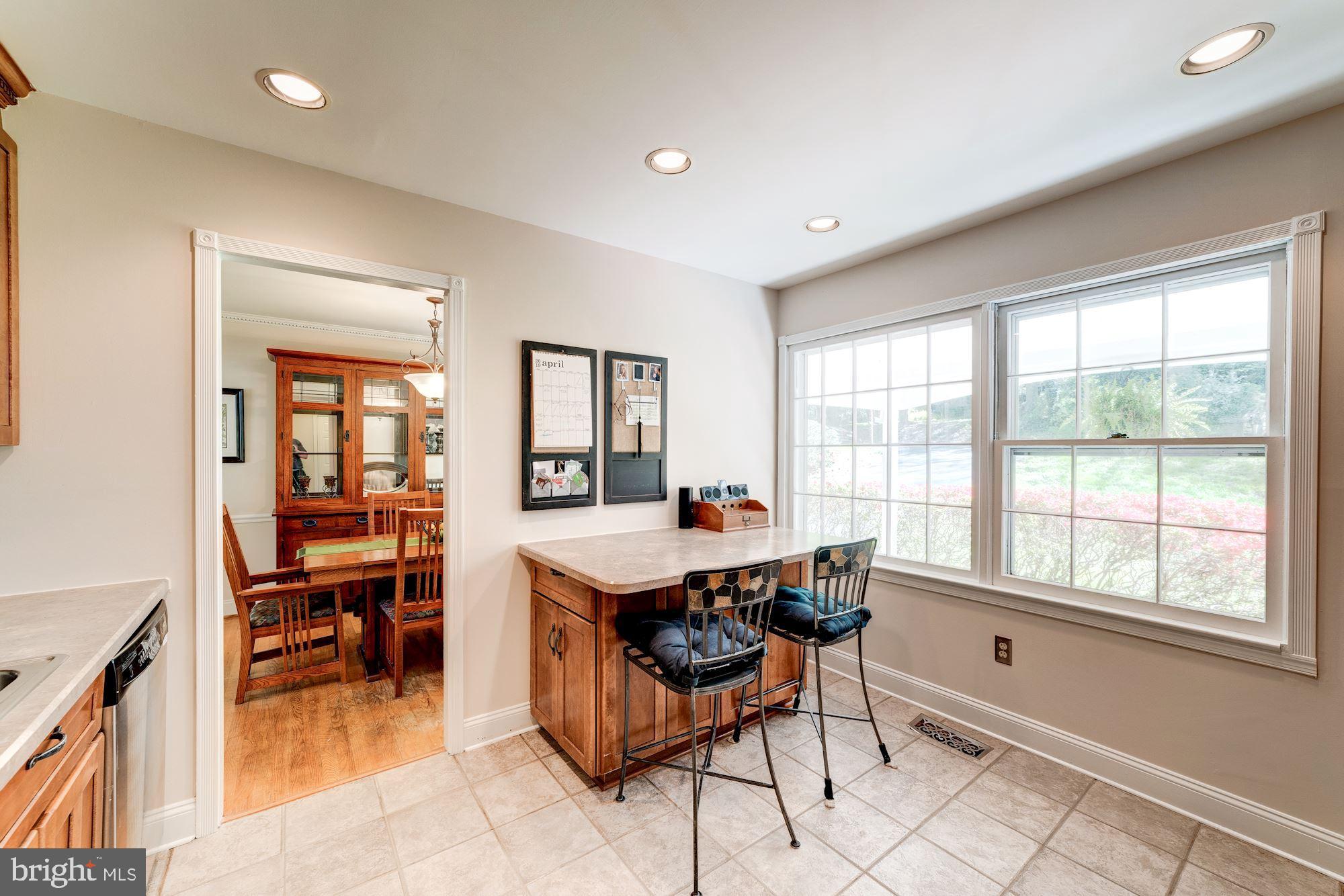 11310 Myrtle Lane Reston, VA 20191 - Photo 10 of 42 a dining room with a table and chairs