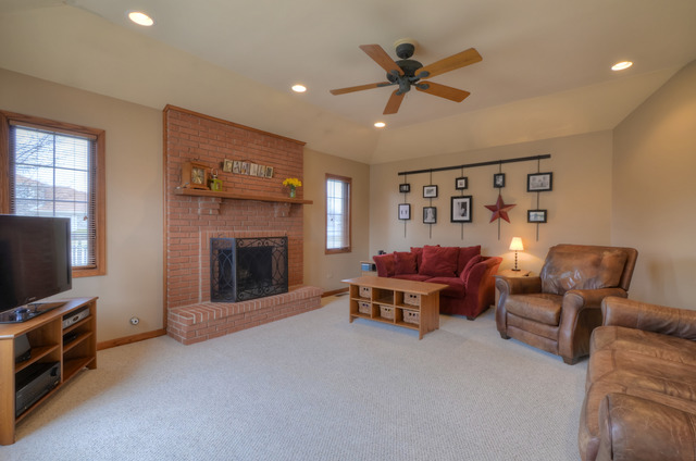 21206 Deerpath Road Frankfort, IL 60423 - Photo 9 of 25 a living room with furniture and a flat screen tv