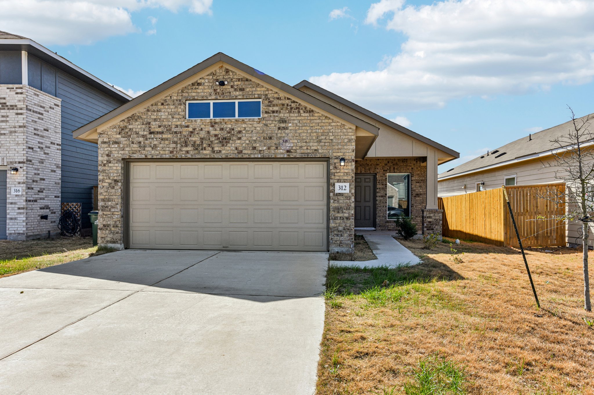 312 The Bad Way Jarrell, TX 76537 - Photo 1 of 38 a front view of a house with yard