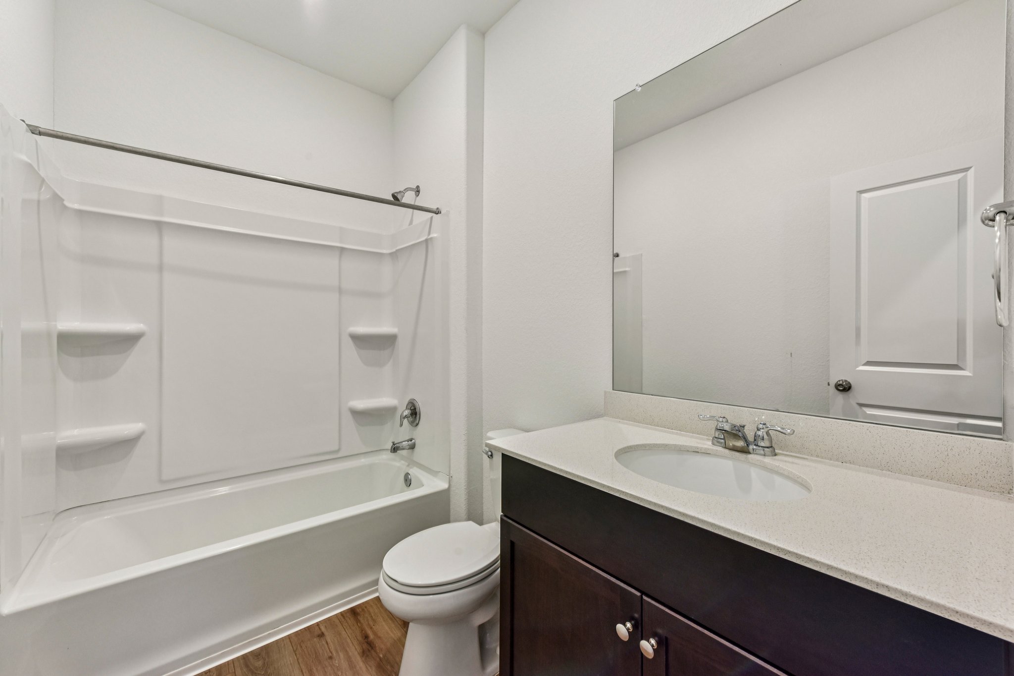 312 The Bad Way Jarrell, TX 76537 - Photo 14 of 38 a bathroom with a sink a toilet and shower