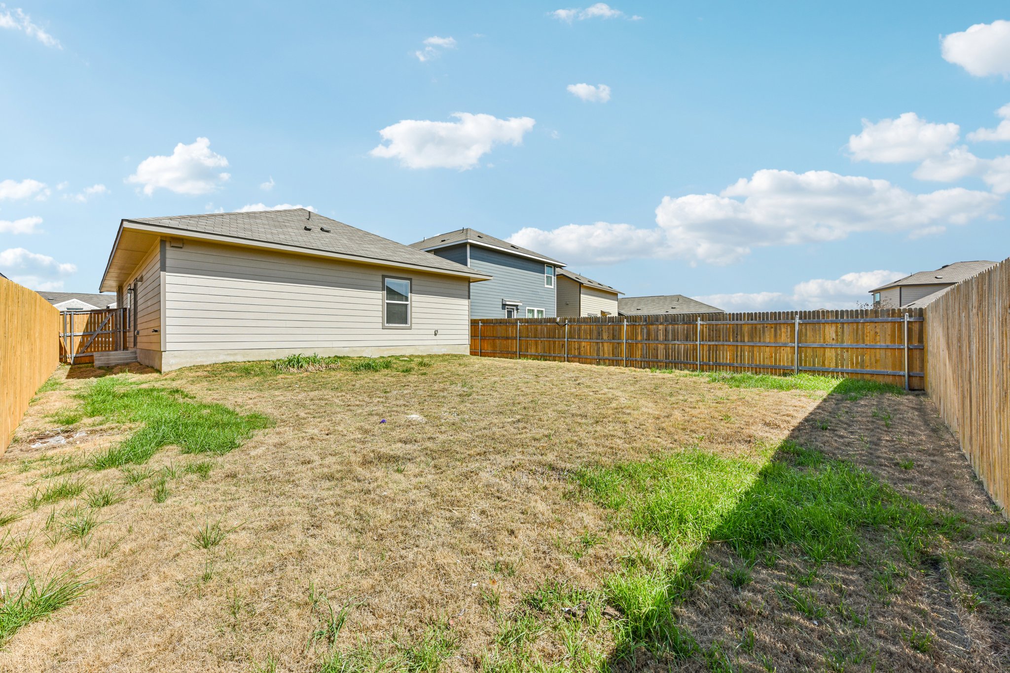 312 The Bad Way Jarrell, TX 76537 - Photo 34 of 38 a front view of a house with garden