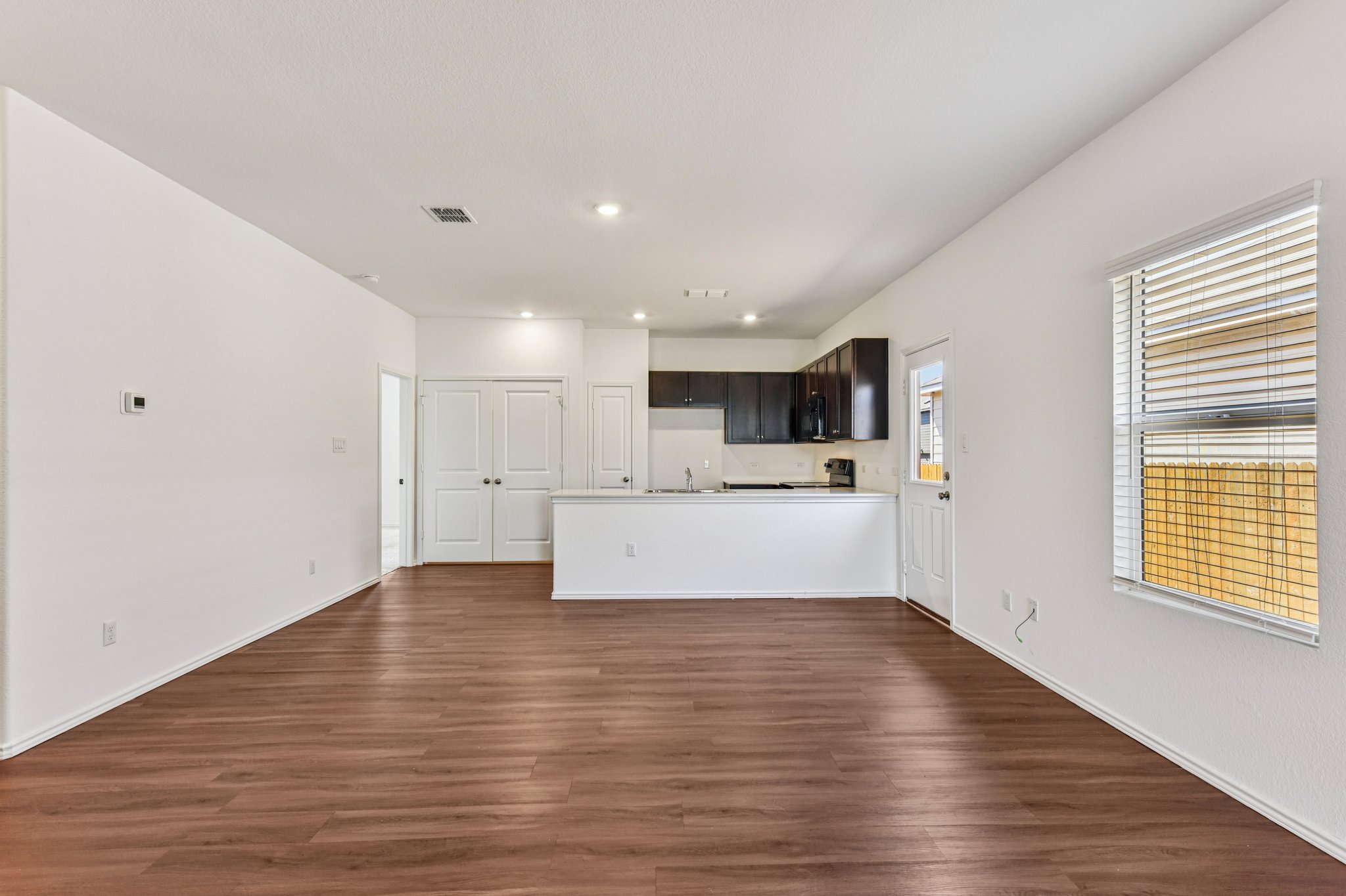 312 The Bad Way Jarrell, TX 76537 - Photo 6 of 38 a view of kitchen with wooden floor