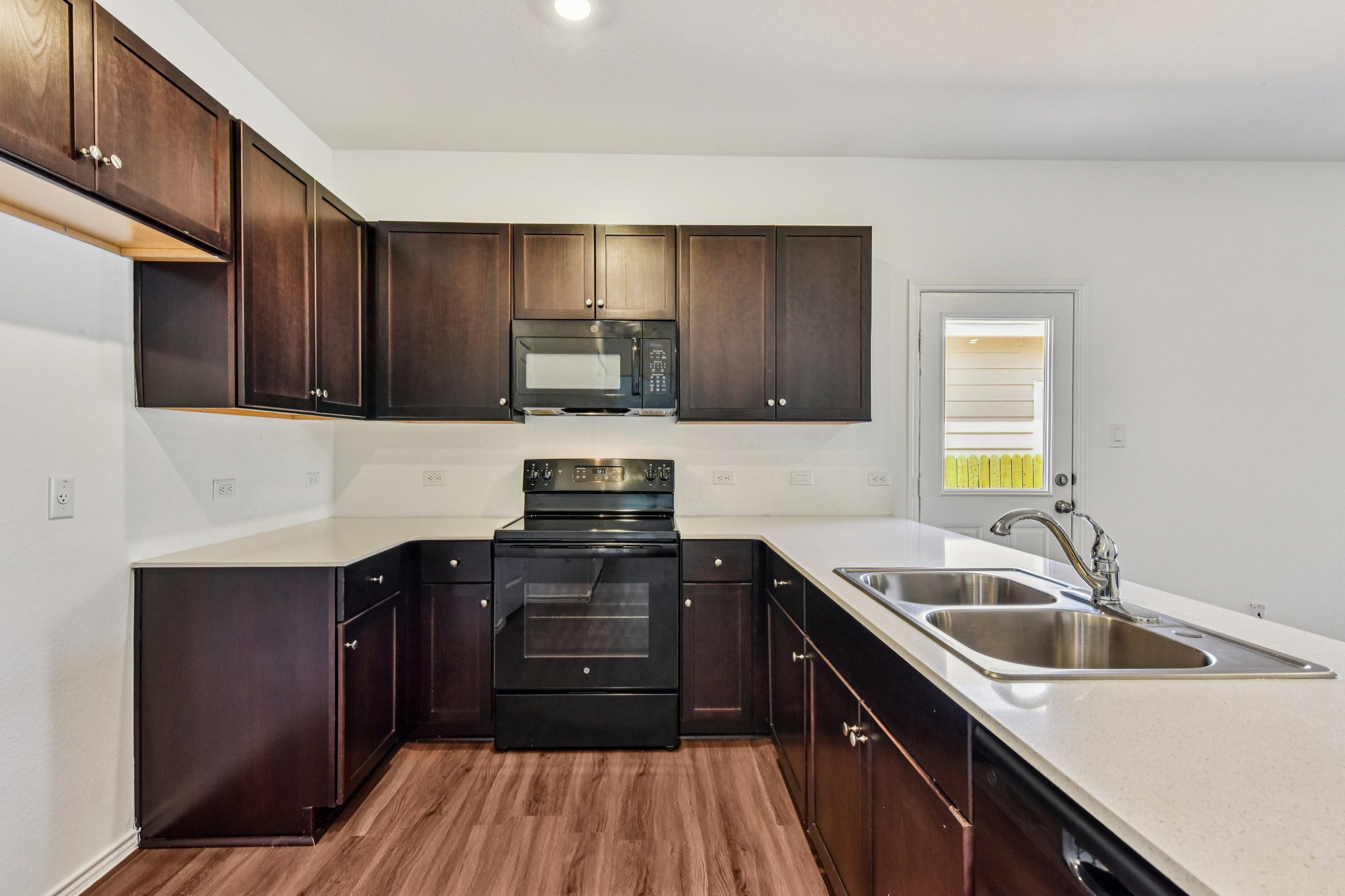 312 The Bad Way Jarrell, TX 76537 - Photo 8 of 38 a kitchen with a sink a stove and cabinets