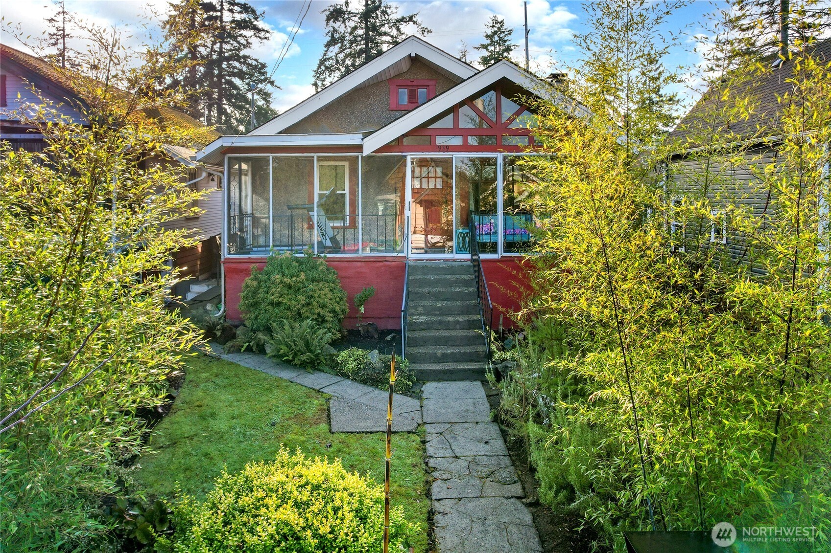 a front view of a house with a yard and fountain