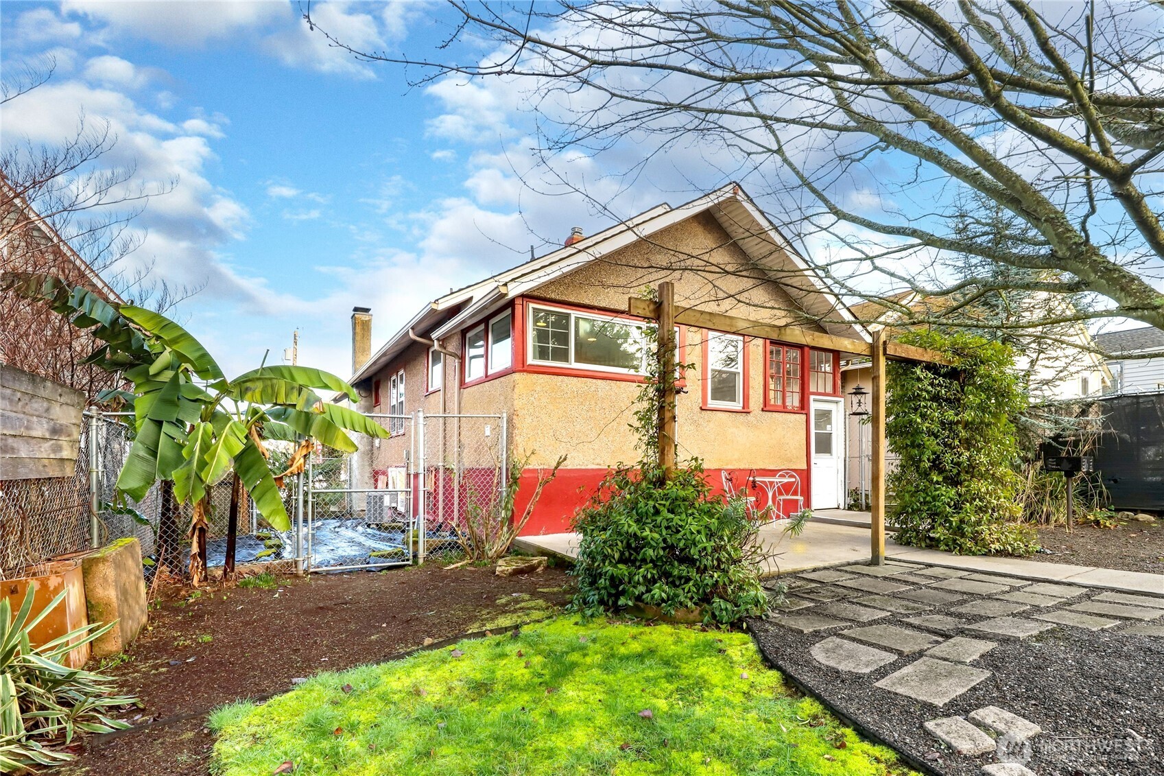 1939 Gregory Way Bremerton, WA 98337 - Photo 26 of 36 a backyard of a house with flower plants and trees