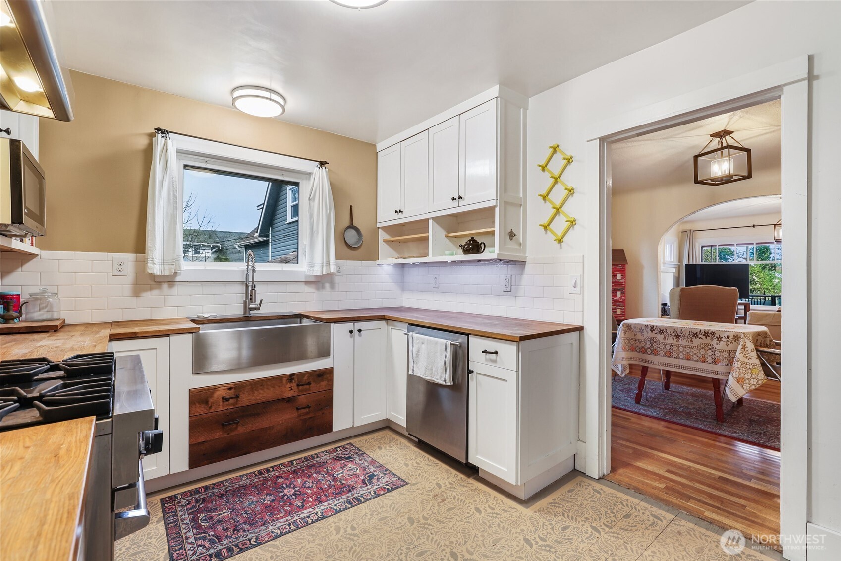 1939 Gregory Way Bremerton, WA 98337 - Photo 9 of 36 a kitchen with stainless steel appliances granite countertop a stove a sink and a microwave
