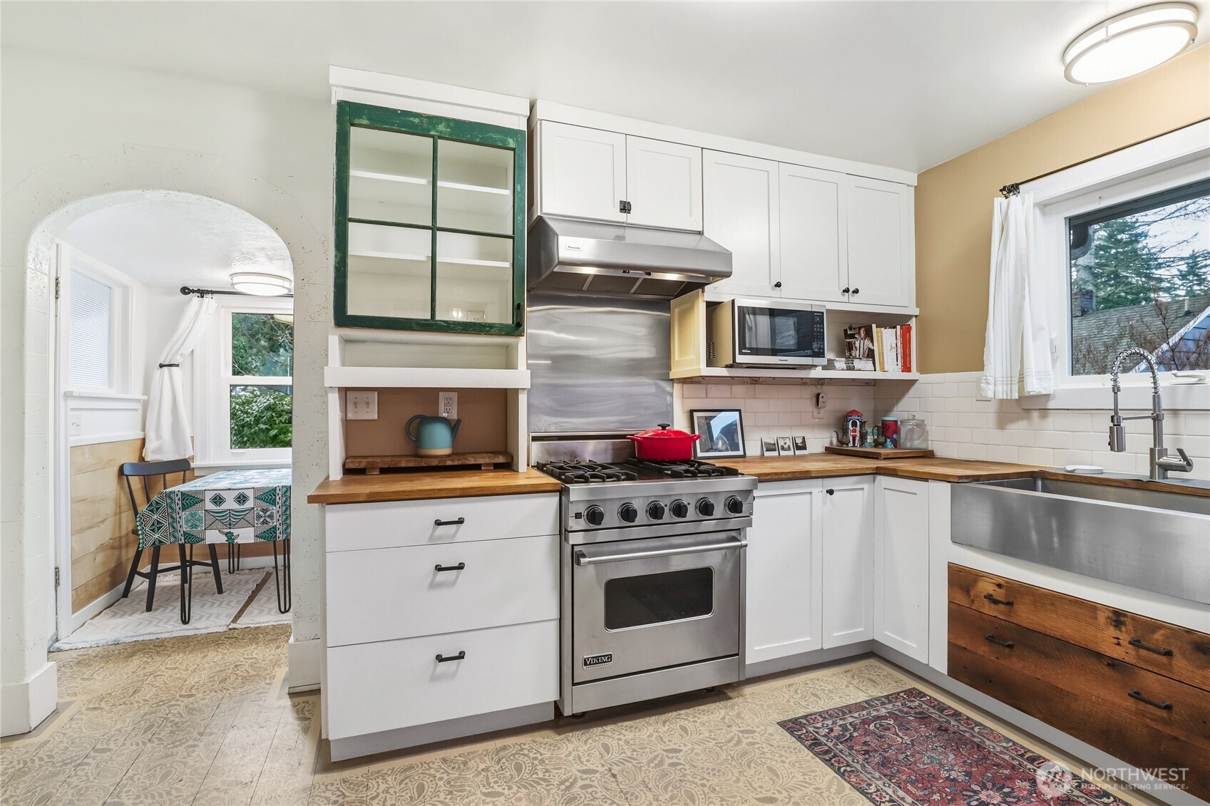 1939 Gregory Way Bremerton, WA 98337 - Photo 10 of 36 a kitchen with granite countertop a stove top oven sink and cabinets
