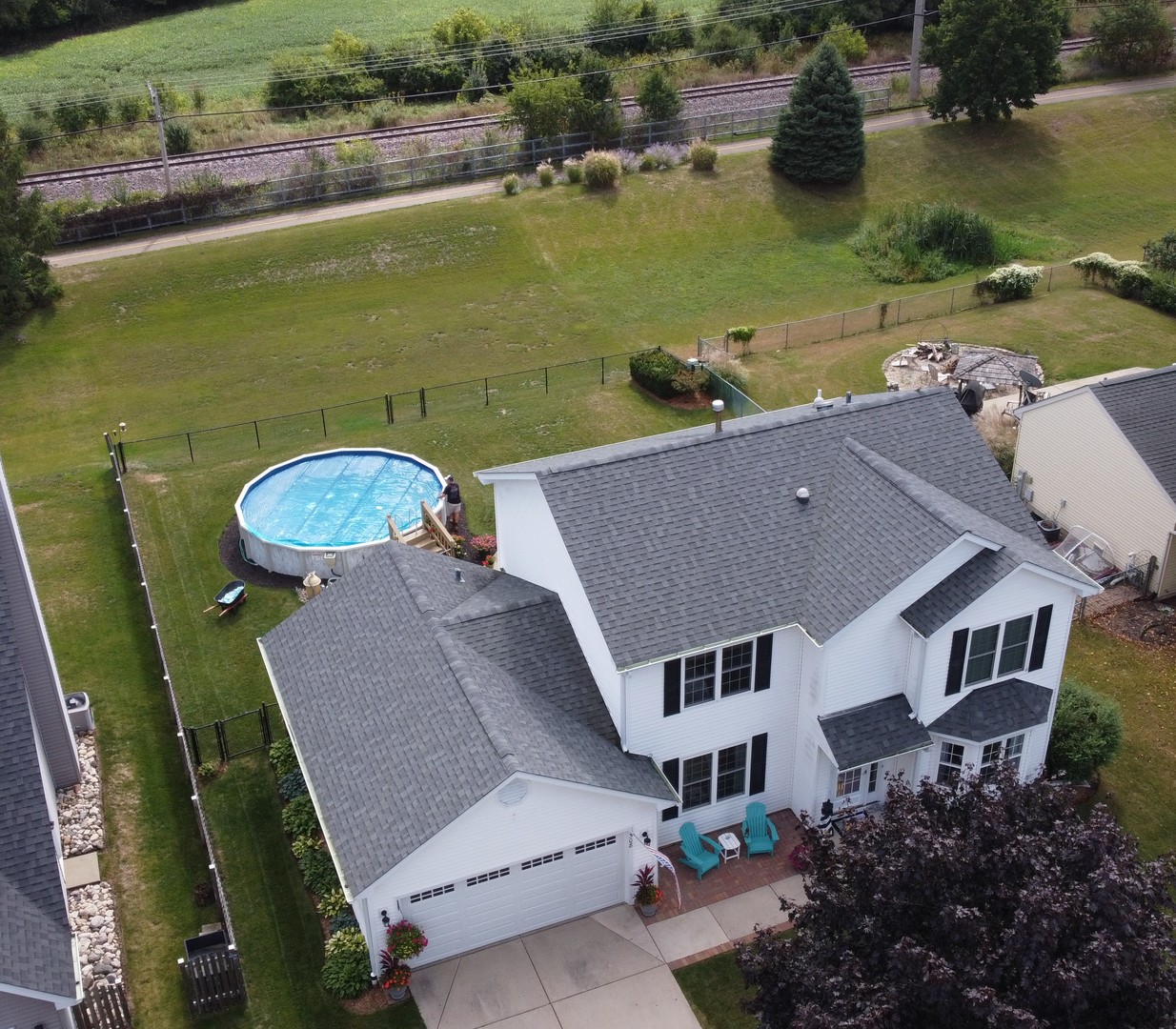 an aerial view of a house with a lake view