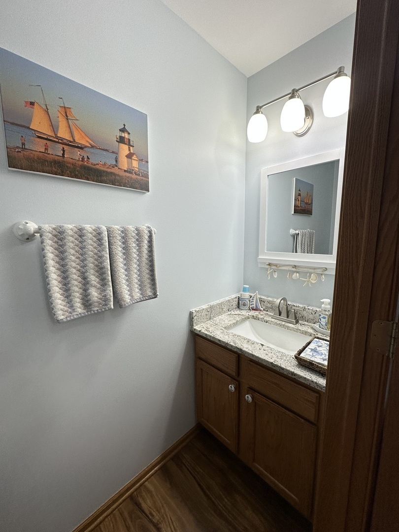 308 Glenbrook Trail McHenry, IL 60050 - Photo 22 of 29 a bathroom with a granite countertop sink and a mirror