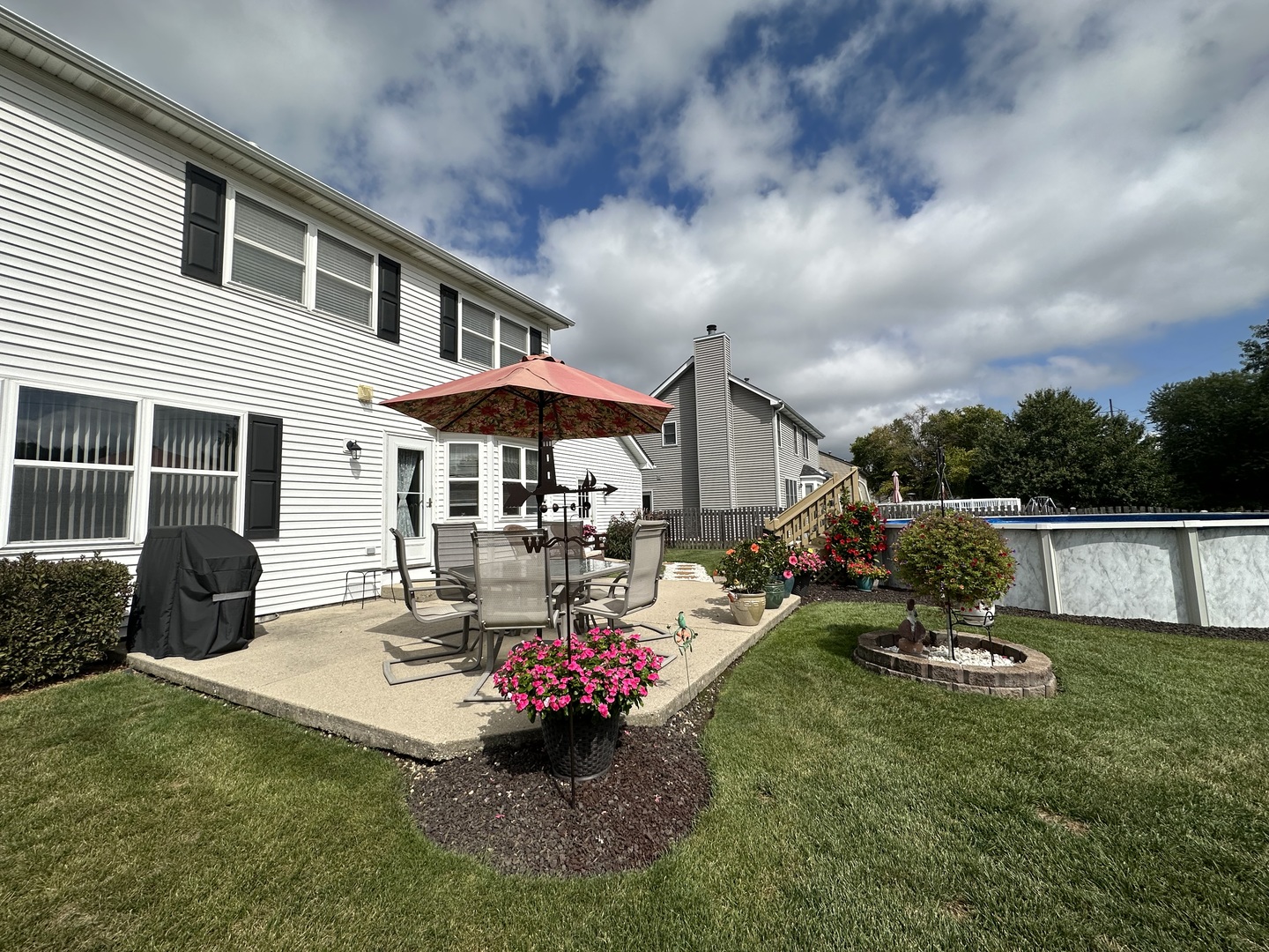308 Glenbrook Trail McHenry, IL 60050 - Photo 25 of 29 a view of a house with backyard sitting area and garden