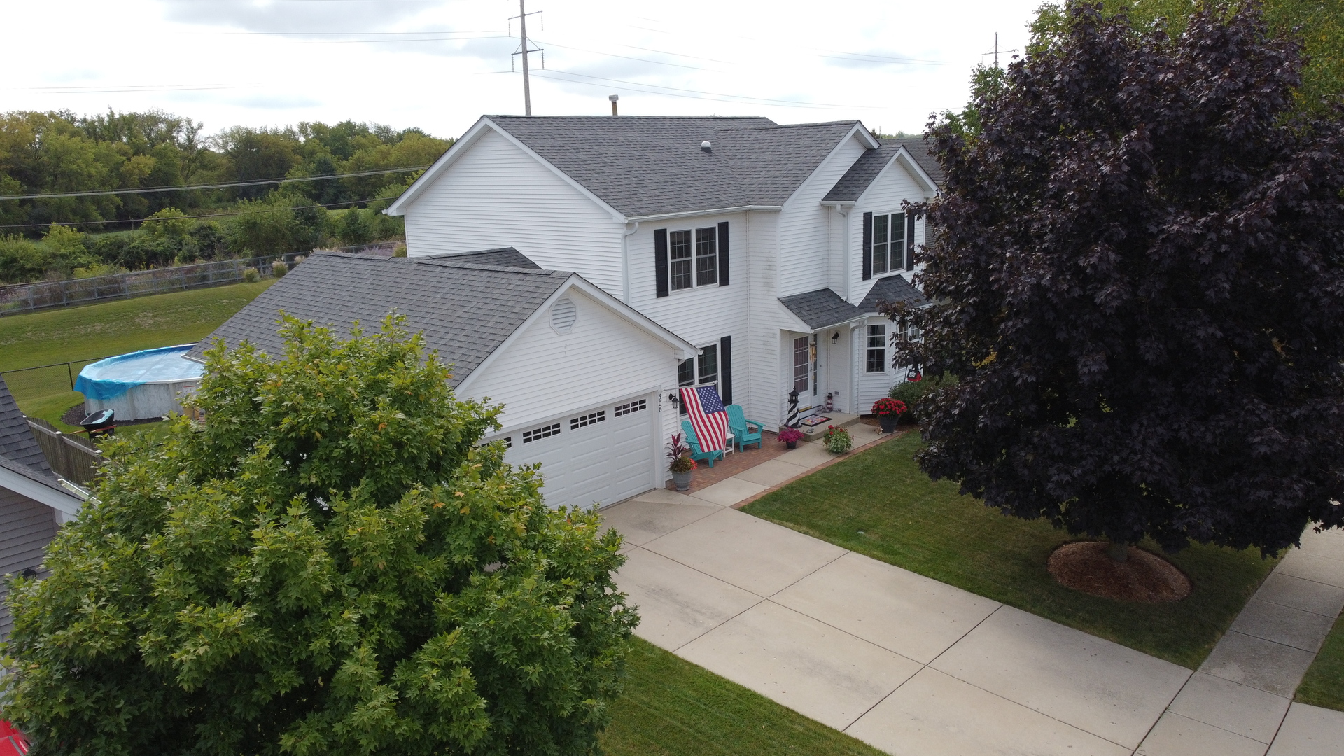 308 Glenbrook Trail McHenry, IL 60050 - Photo 29 of 29 a front view of a house with garden