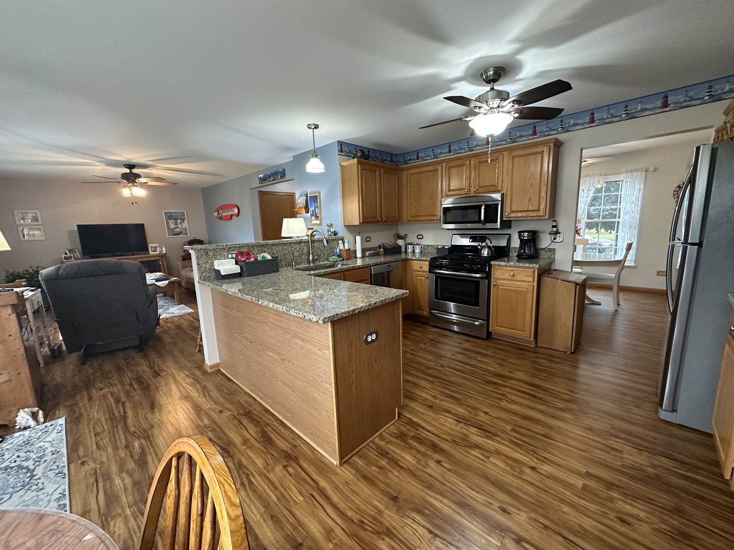 308 Glenbrook Trail McHenry, IL 60050 - Photo 6 of 29 a kitchen with a stove a sink dishwasher and a refrigerator