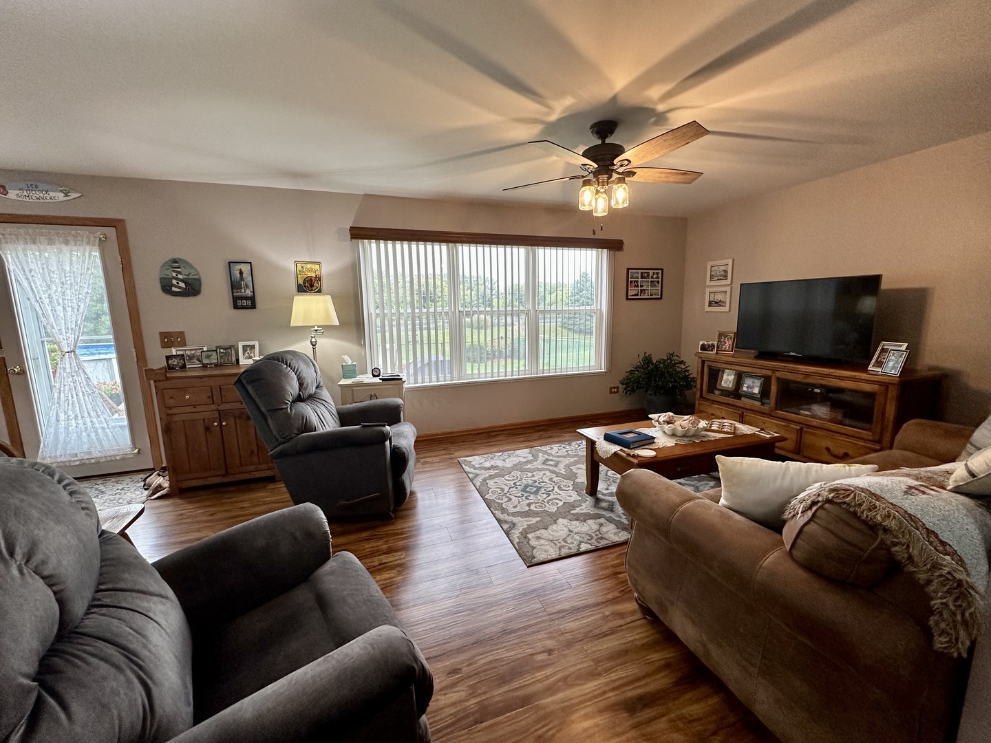 308 Glenbrook Trail McHenry, IL 60050 - Photo 8 of 29 a living room with furniture and a flat screen tv