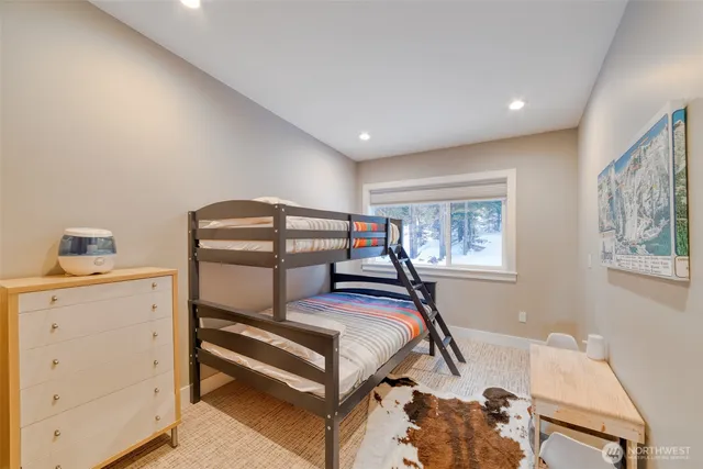 a bedroom with furniture and a window