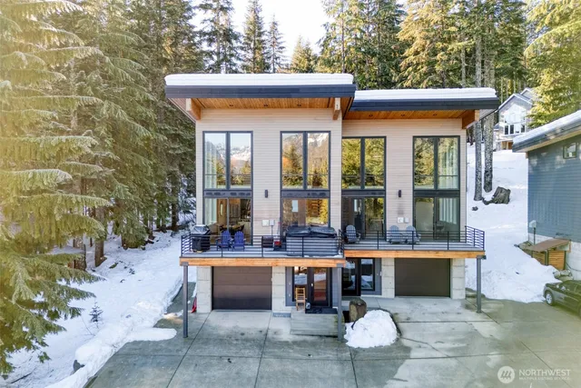 a view of a patio with table and chairs potted plants and large tree