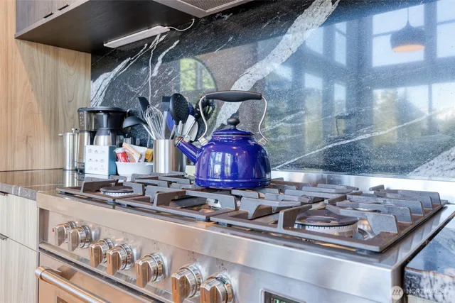 a kitchen with lots of different colored cloths