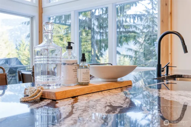 a living room filled with furniture and a floor to ceiling window