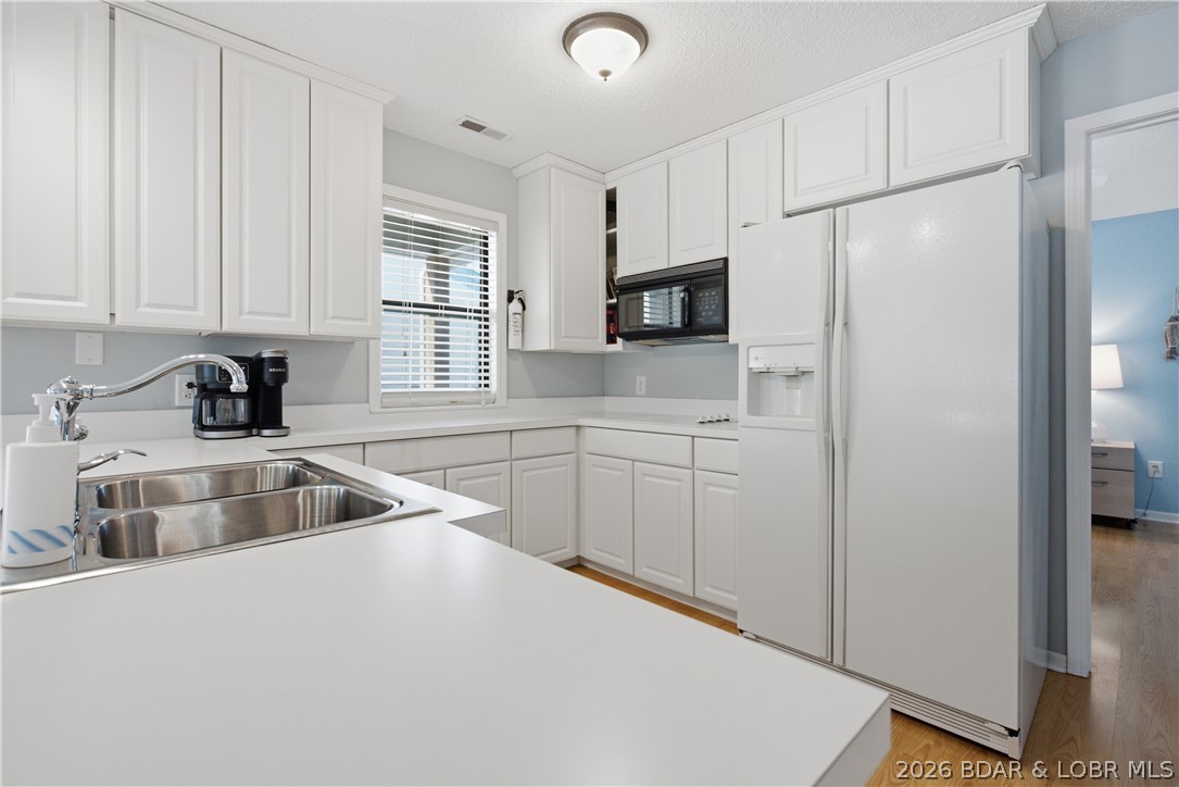 80 Willow Ridge Road, Unit 3B Lake Ozark, MO 65049 - Photo 8 of 37 Bright white kitchen