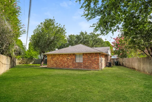 a view of a backyard with a small cabin
