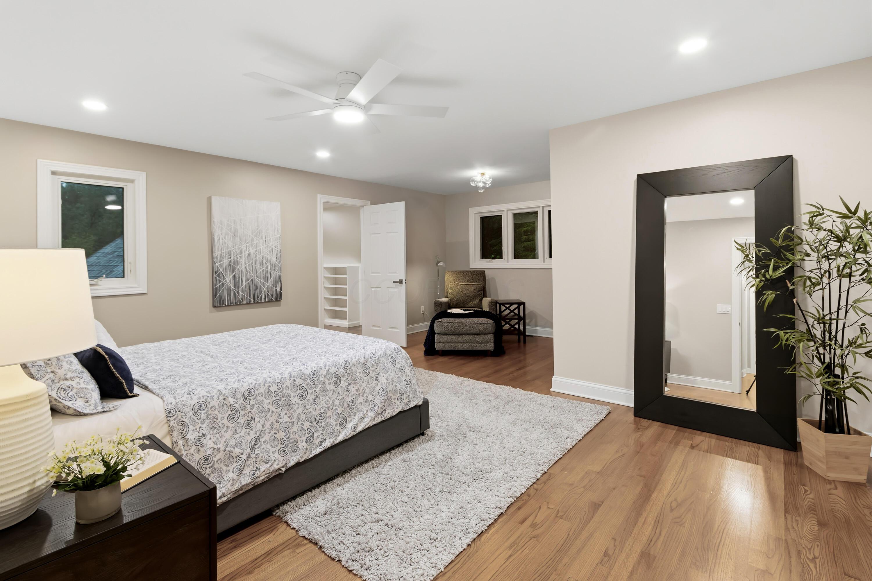 1560 Carriage Road Powell, OH 43065 - Photo 35 of 73 Large primary bedroom featuring hardwood flooring, recessed lighting and ceiling fan