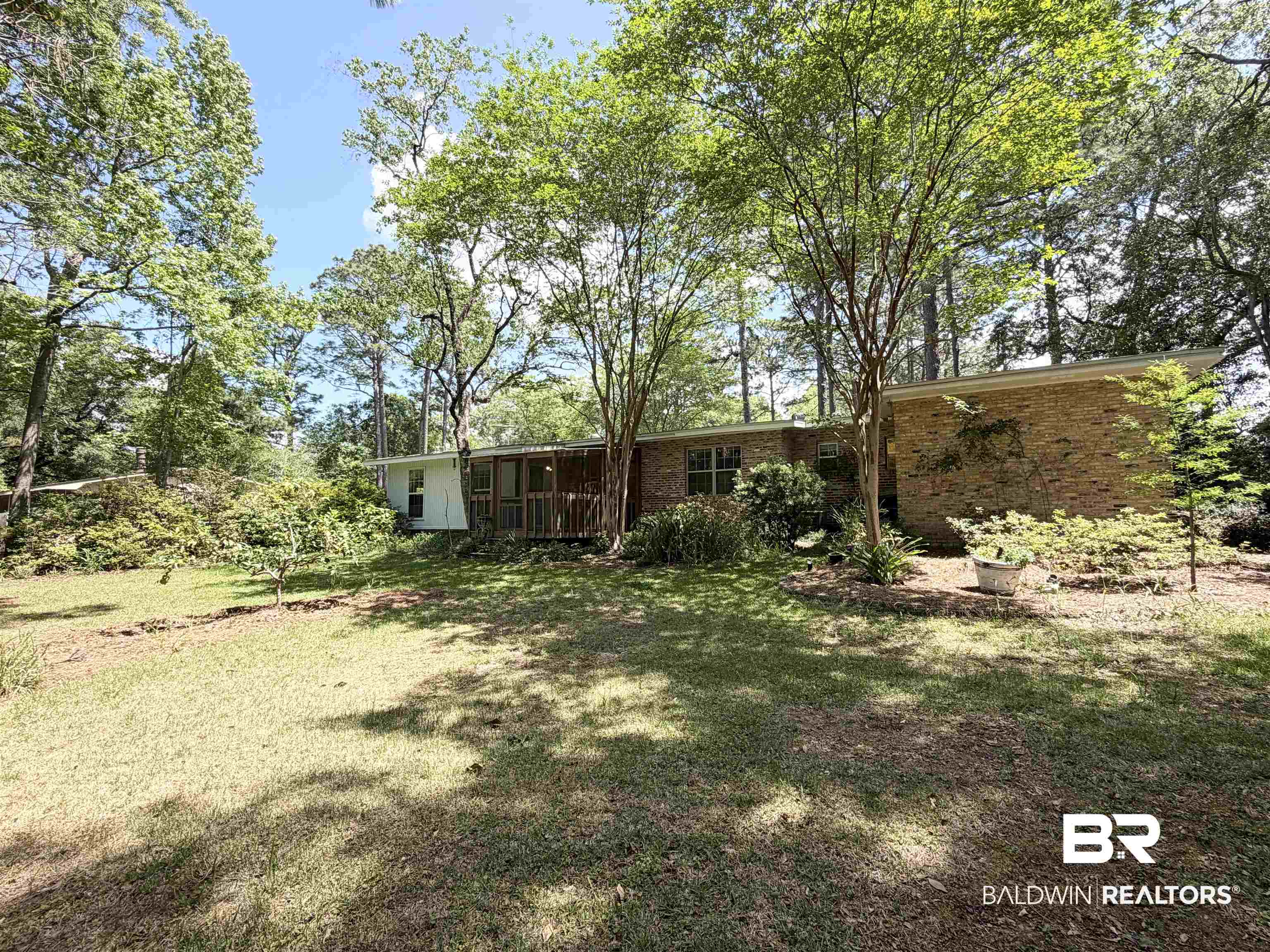 1075 Zurich Street Mobile, AL 36608 - Photo 31 of 35 Back of house featuring a yard and brick siding