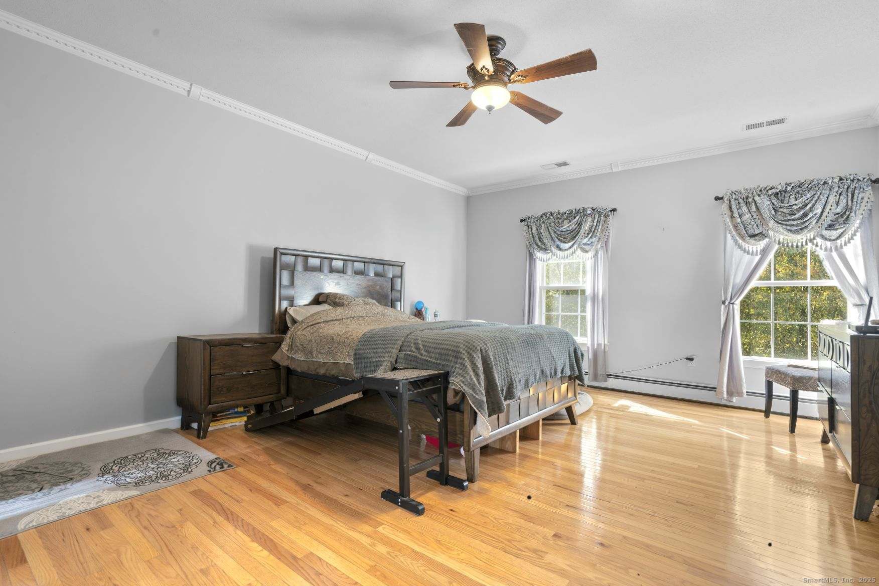 63 Taylor Road Colchester, CT 06415 - Photo 13 of 40 a bedroom with a bed and a chandelier