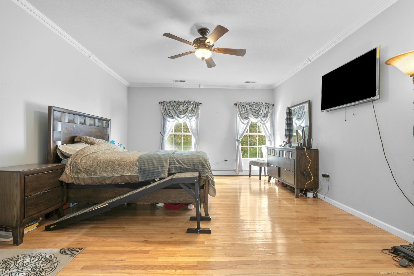 63 Taylor Road Colchester, CT 06415 - Photo 14 of 40 a bedroom with a bed and a flat screen tv