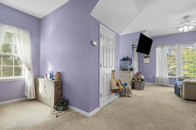 a view of a livingroom with furniture and a flat screen tv