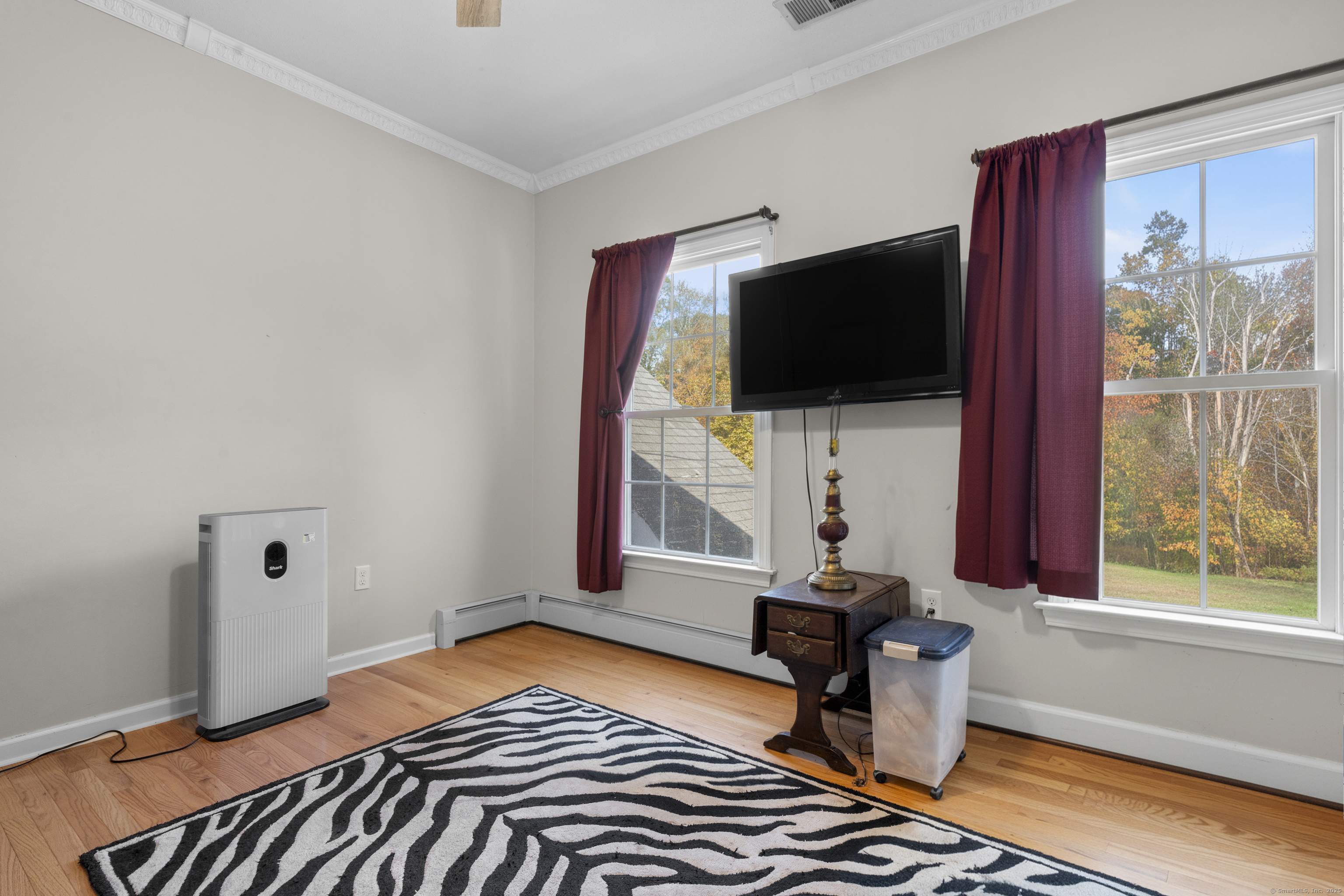 63 Taylor Road Colchester, CT 06415 - Photo 25 of 40 a bedroom with a bed and a flat screen tv