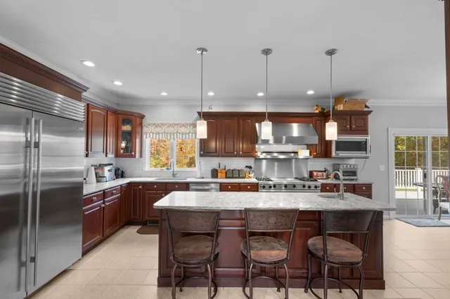 a kitchen with granite countertop a sink and counter space