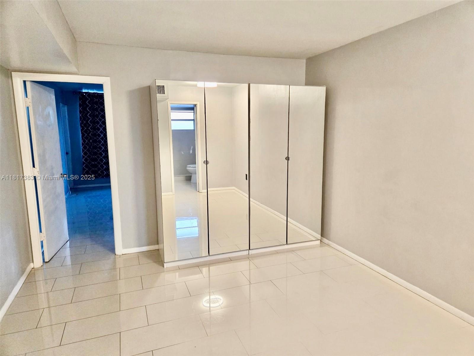 1780 Northeast 191st Street, Unit 4092 Miami, FL 33179 - Photo 19 of 22 a view of an empty room