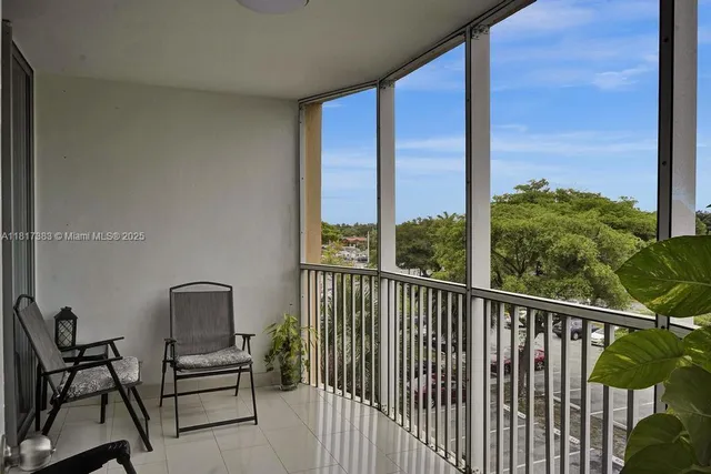 a view of a balcony with chairs