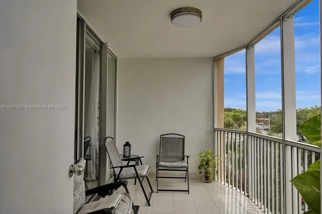 a view of a balcony with chairs