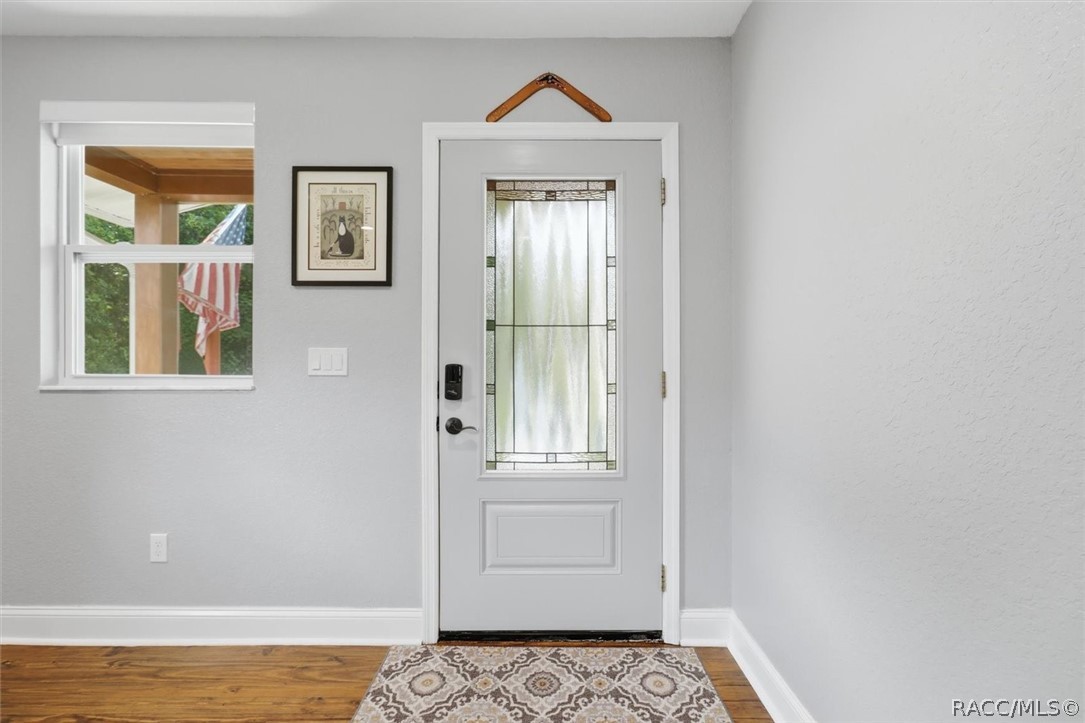 4099 West Ridge Court Dunnellon, FL 34433 - Photo 12 of 49 Entrance to home can be any kind of Bonus Room? Office, Den, living room or whatever suits you families needs. Requesting you please take off your shoes or wear slippers. Very protective of those amazing Pine floors!