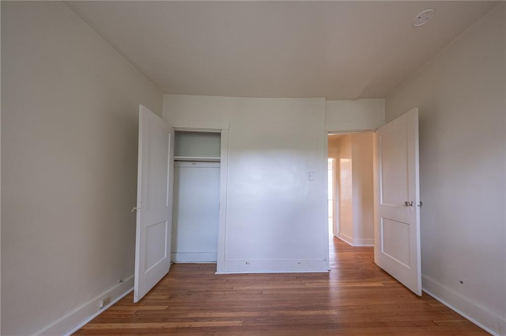 7315 Whipple Street Pittsburgh, PA 15218 - Photo 16 of 24 an empty room with wooden floor & windows