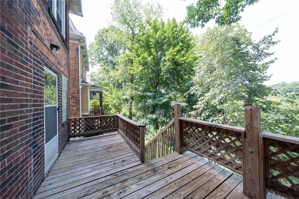 7315 Whipple Street Pittsburgh, PA 15218 - Photo 10 of 24 a balcony with wooden floor and wooden floor